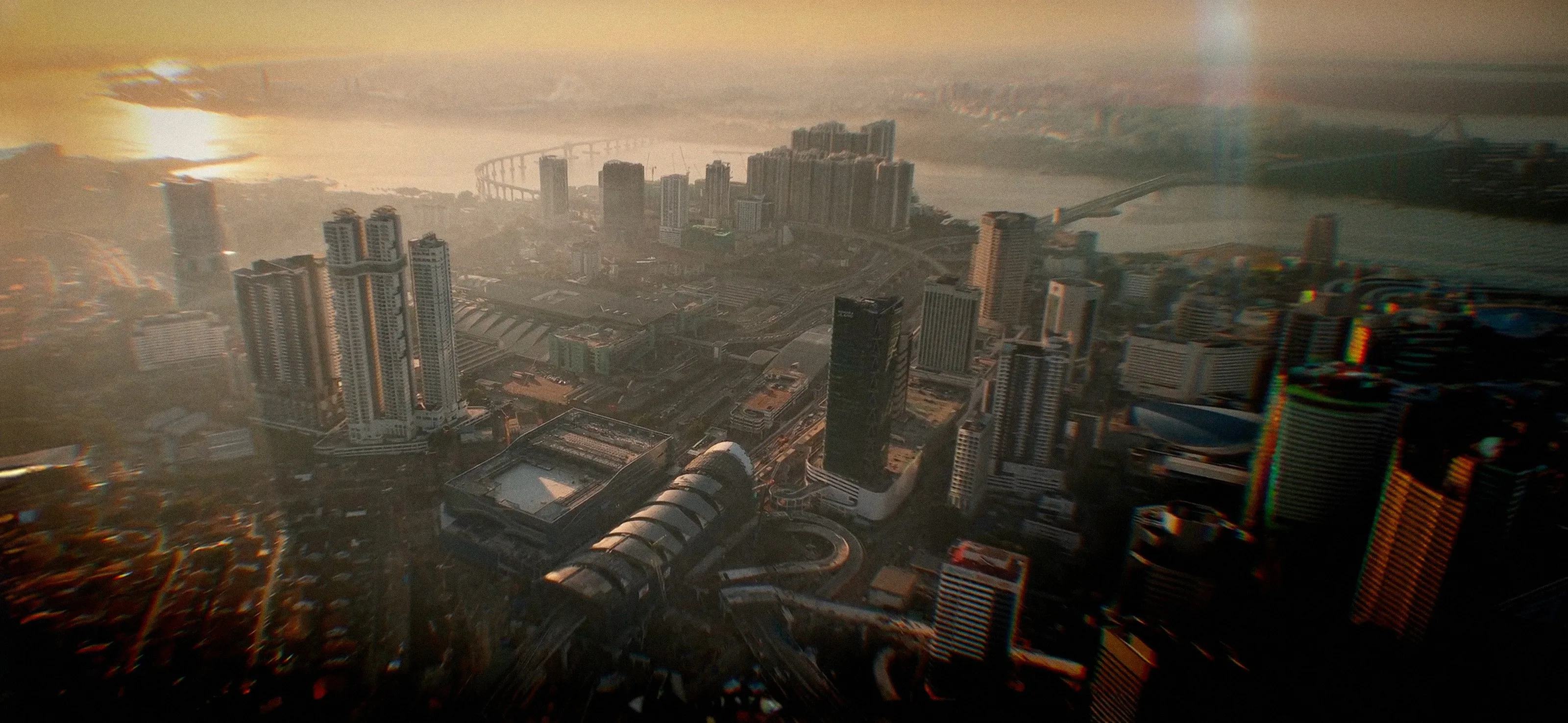 Aerial view at golden hour over Johor Bahru, looking down the Straits of Johor with the Causeway crossing to Singapore in the distance