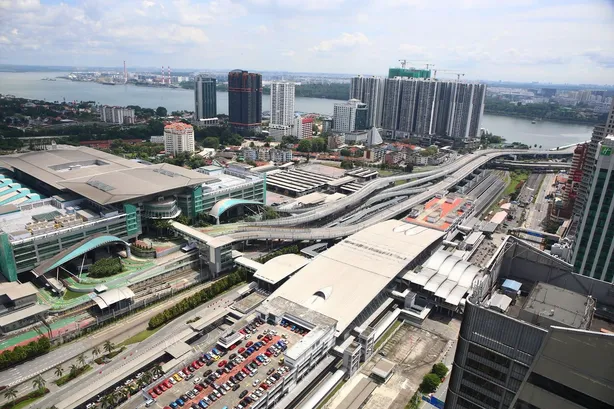 Elevated view over Bukit Chagar and the Causeway, with the Straits of Johor beyond