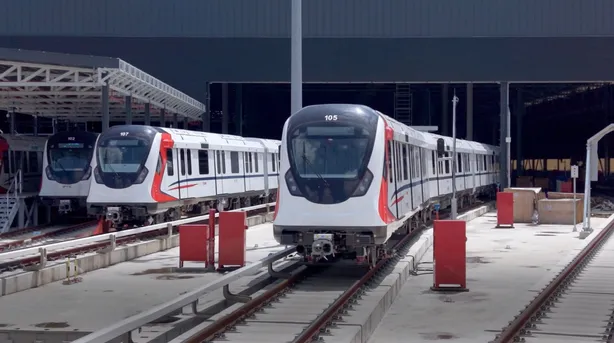 Three RTS Link trainsets stabled at Wadi Hana depot, unit 105 on the running rail in the foreground