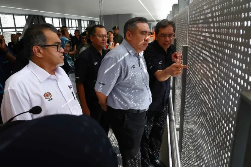 Transport Minister Anthony Loke inspecting the perforated facade at an RTS Link station